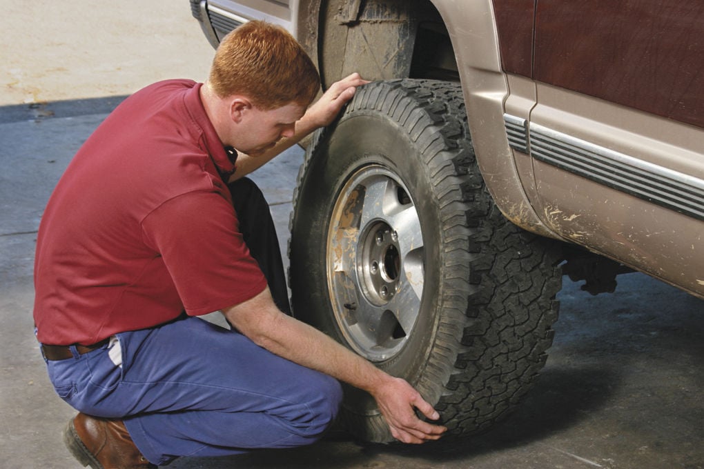 How to get stuck tire off of car