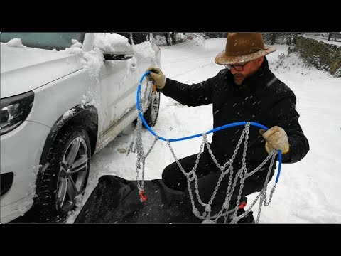 How to put chain on tires in the snow